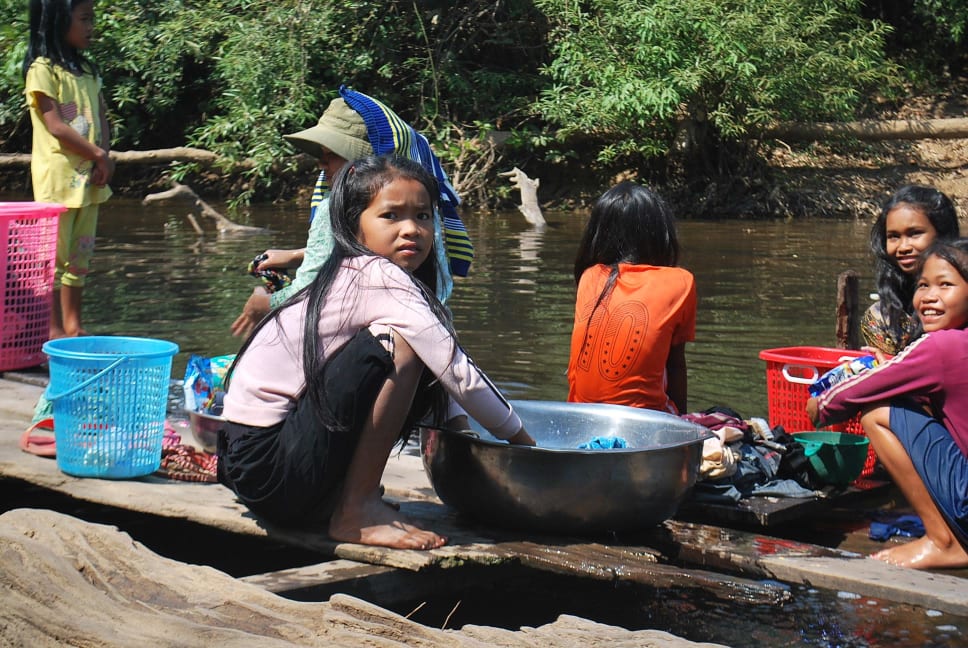A girl in Cambodia doing household chores